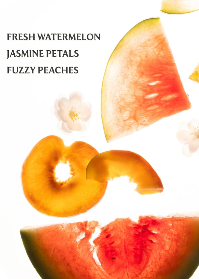 Sliced watermelon and peaches with flowers on a white background