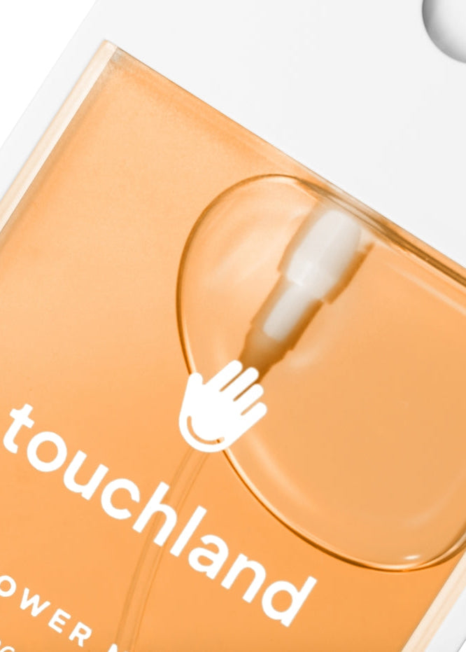 Orange packaging with a white hand icon and 'touchland' text on a white background