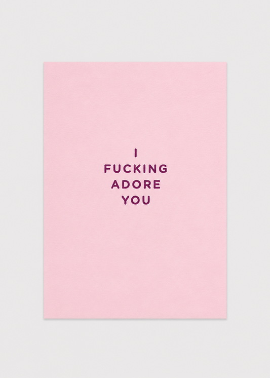 Pink card with black text 'I FUCKING ADORE YOU' on a light gray background