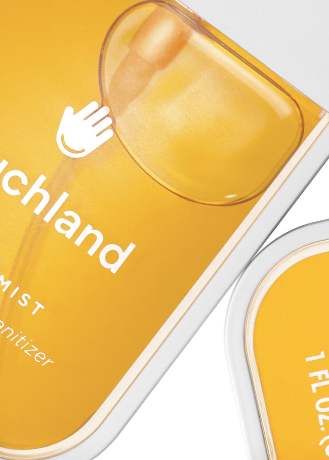 Yellow hand sanitizer bottle with 'ouchland' branding on a white background