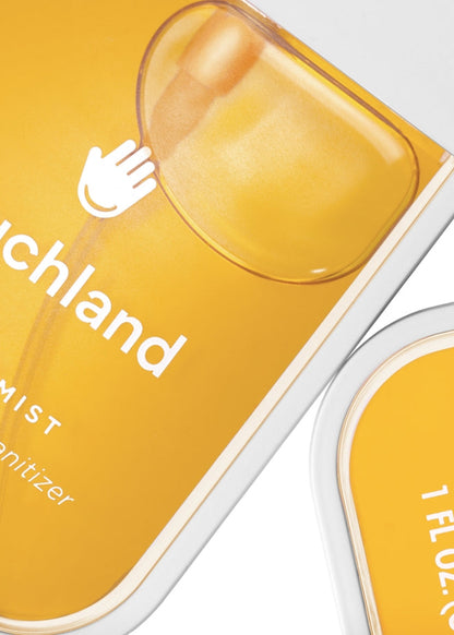 Yellow hand sanitizer bottle with 'ouchland' branding on a white background