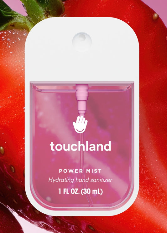 Touchland hand sanitizer packaging with strawberries in the background