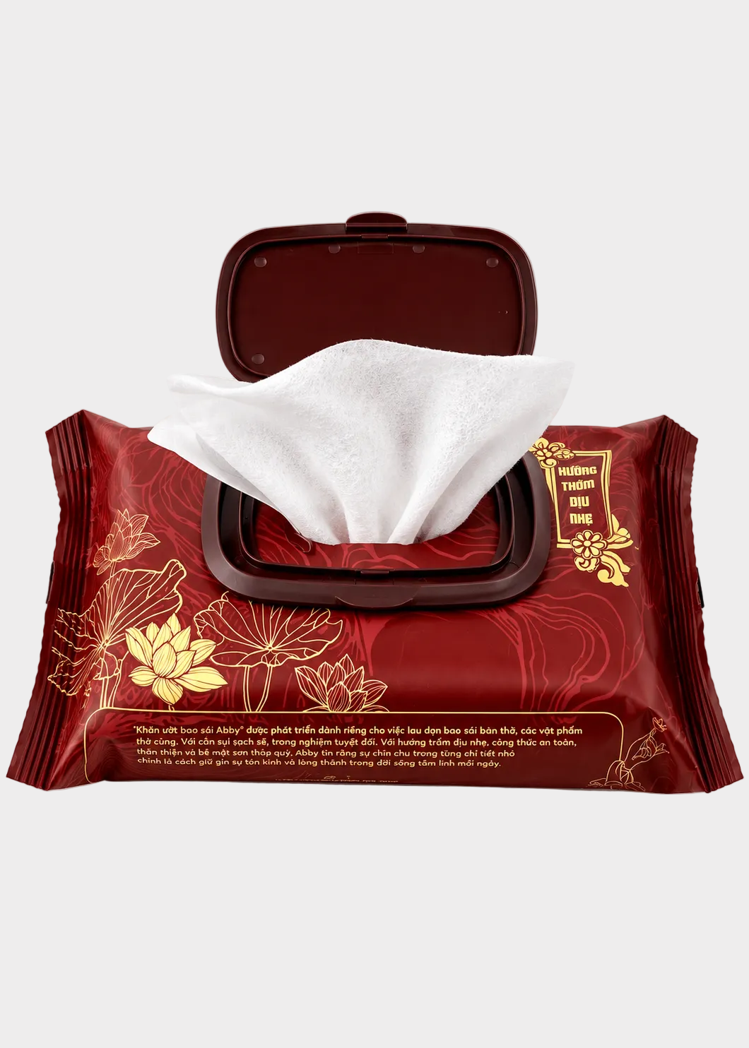 A red package of hand wipes with a hinged lid open, showing a white tissue wipe protruding. The package has gold floral illustrations and text on a clean white background.