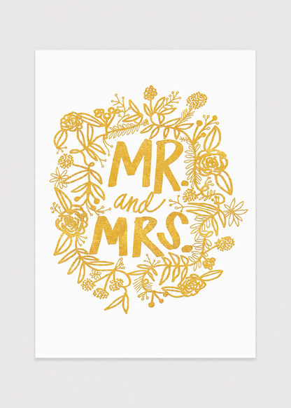 Gold 'MR and MRS' text with floral wreath on a white background