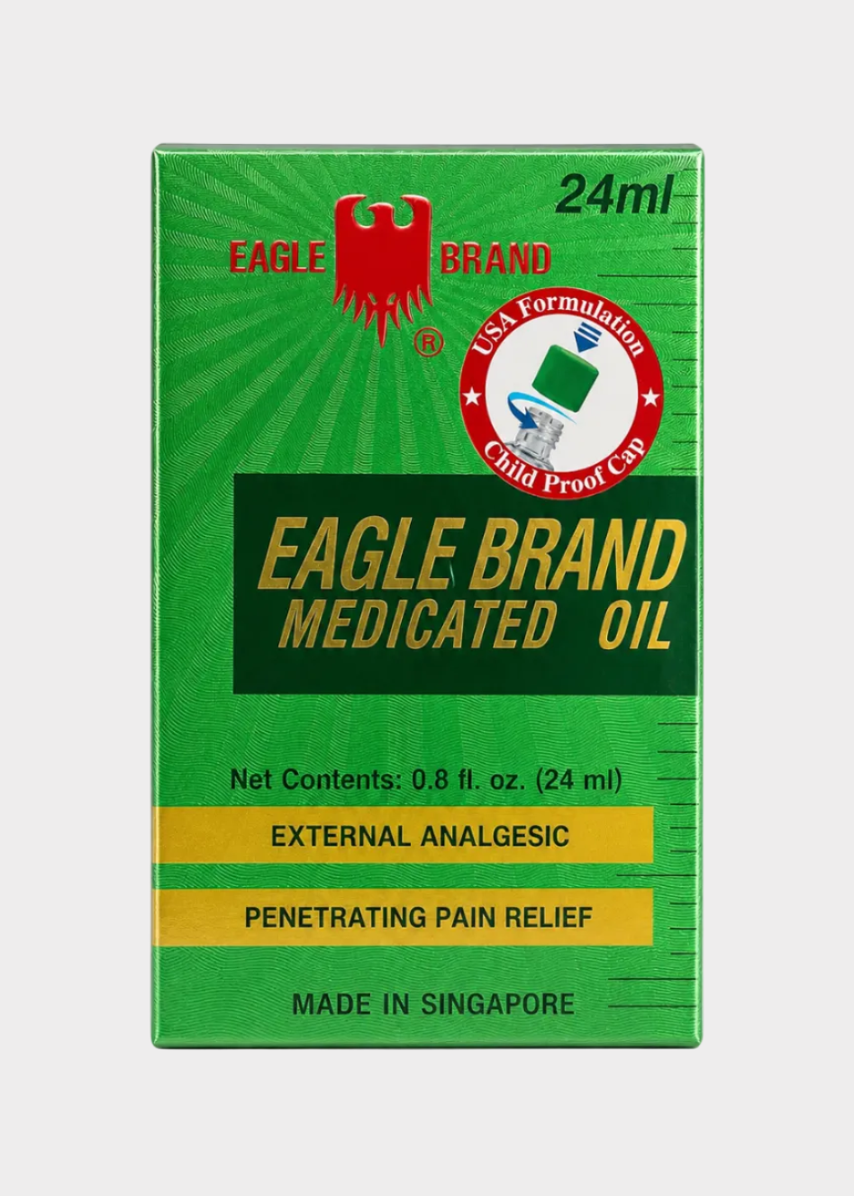 Green box of Eagle Brand Medicated Oil on a white background