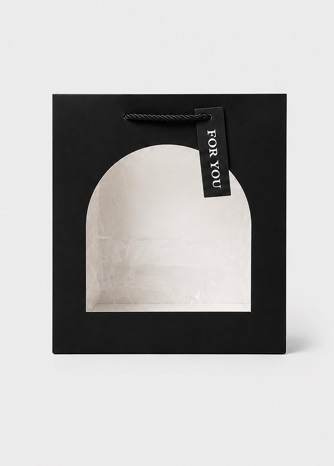 Black gift box with a white interior and 'For You' tag on a light gray background