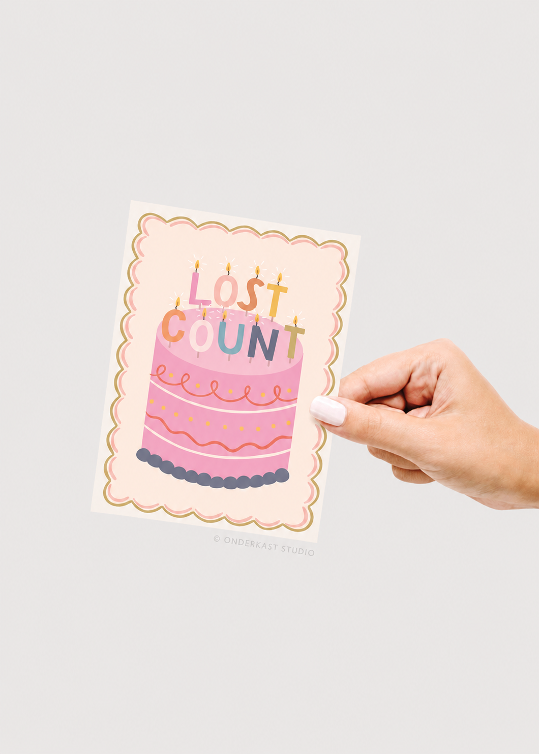 Hand holding a card with 'Lost Count' design on a light gray background