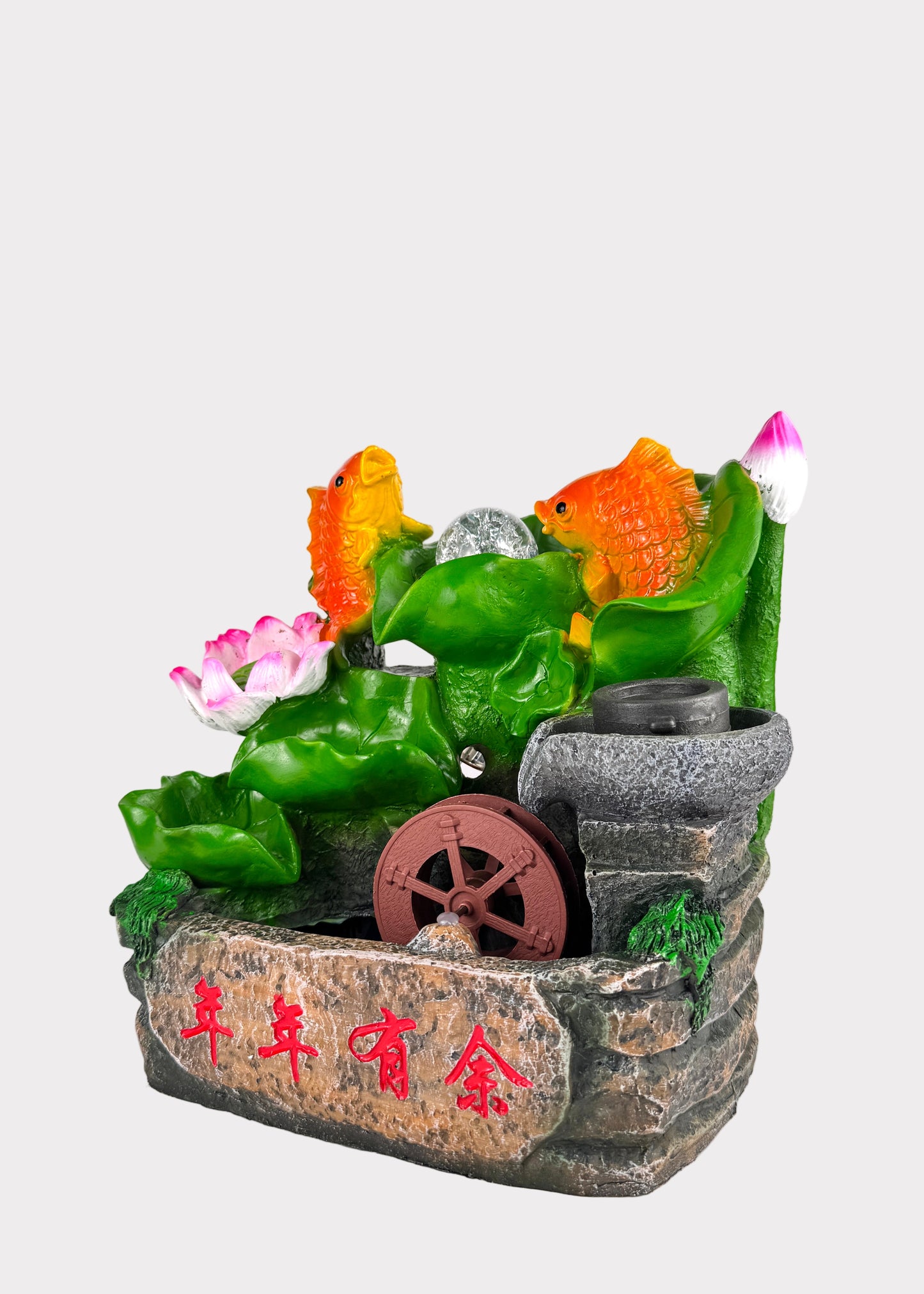 Decorative fountain with fish and plants on a white background