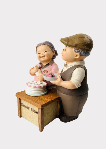 Grandparents Making Cake Figurine