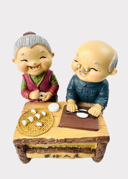 Grandparents Making Dumplings Figurine