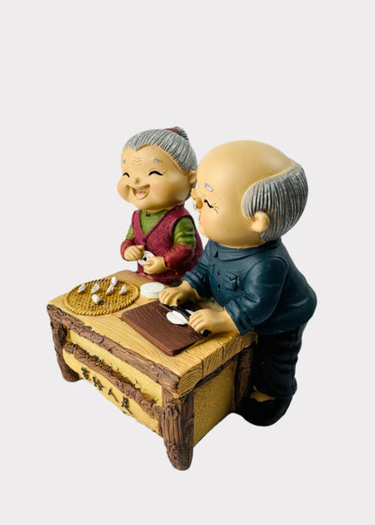 Grandparents Making Dumplings Figurine