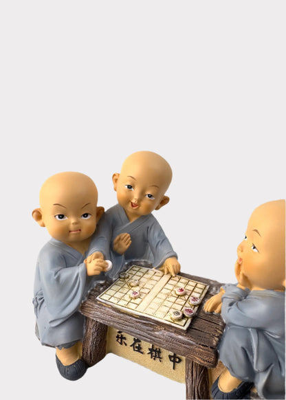 Little Monks Playing Chess Figurine