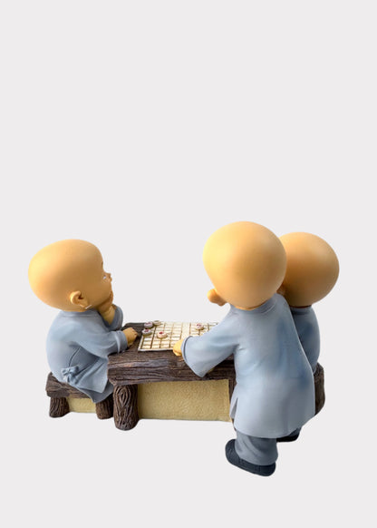Little Monks Playing Chess Figurine