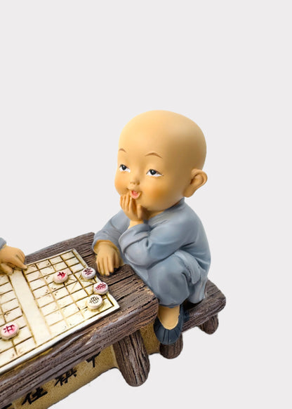 Little Monks Playing Chess Figurine