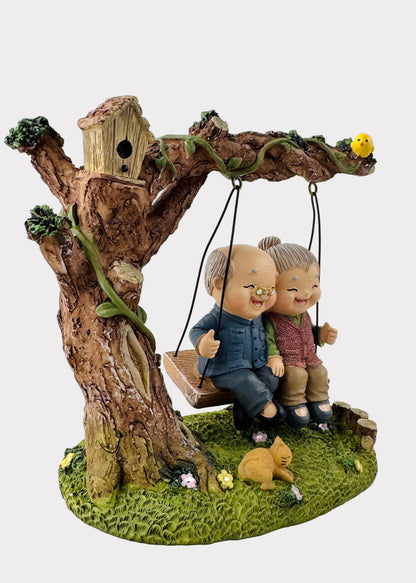 Grandparents on Garden Swing Figurine