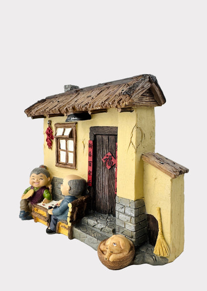 Grandparents Playing Chess  Village House Figurine