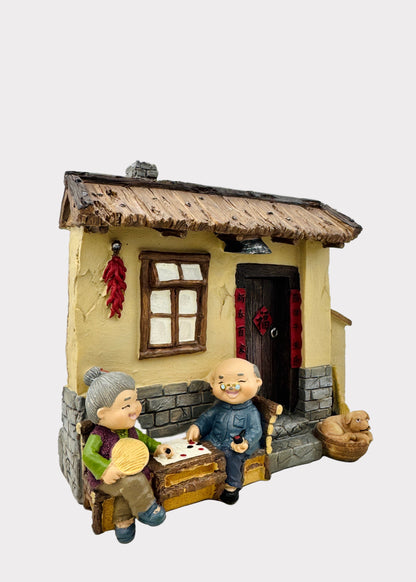 Grandparents Playing Chess  Village House Figurine
