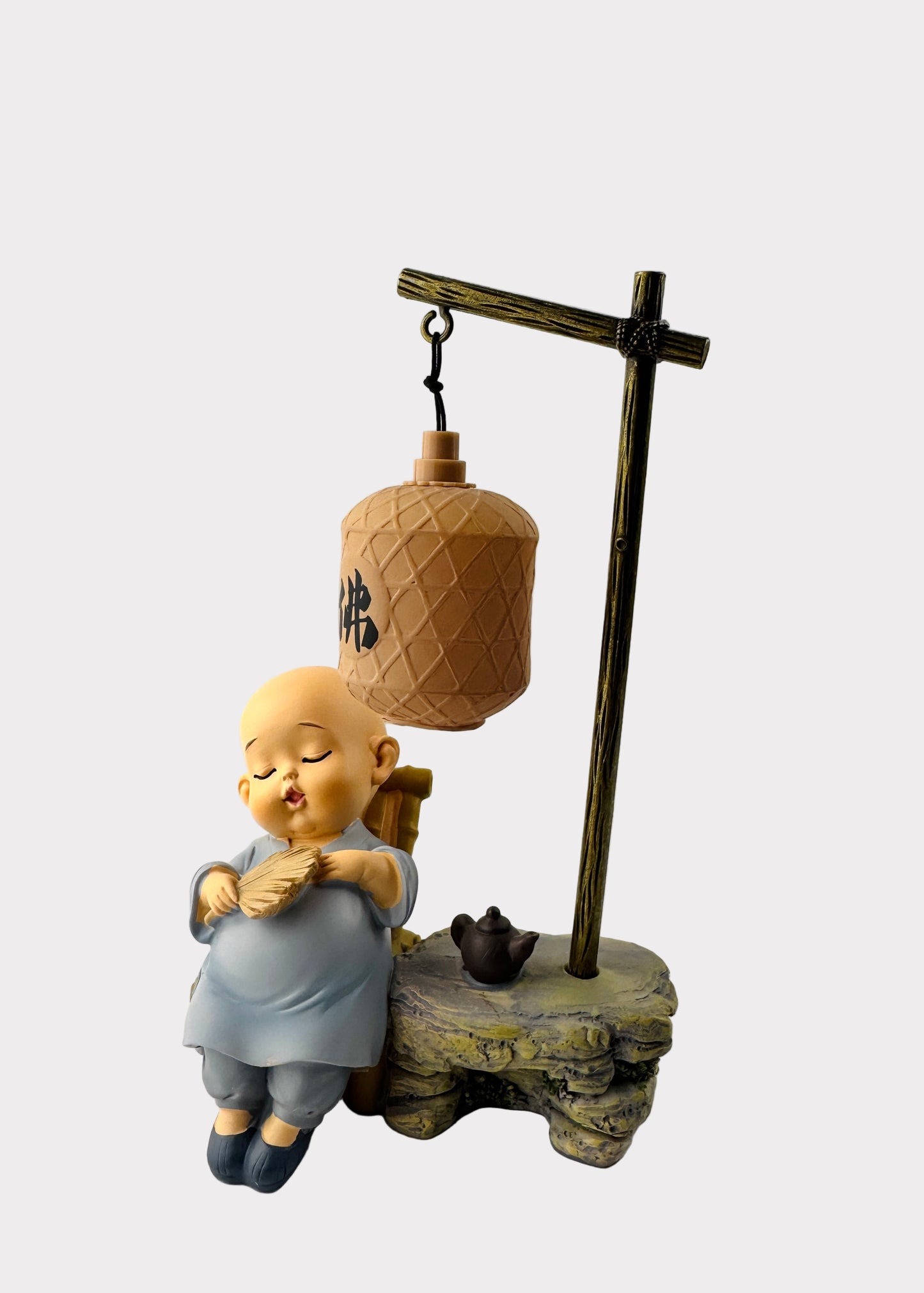 Sleeping Monk with Fan and Teapot Under Lantern