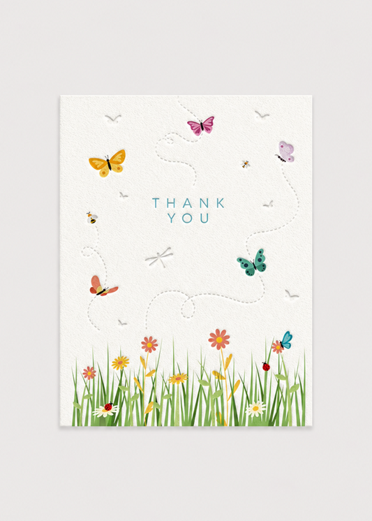 Greeting card with butterflies and flowers on a white background
