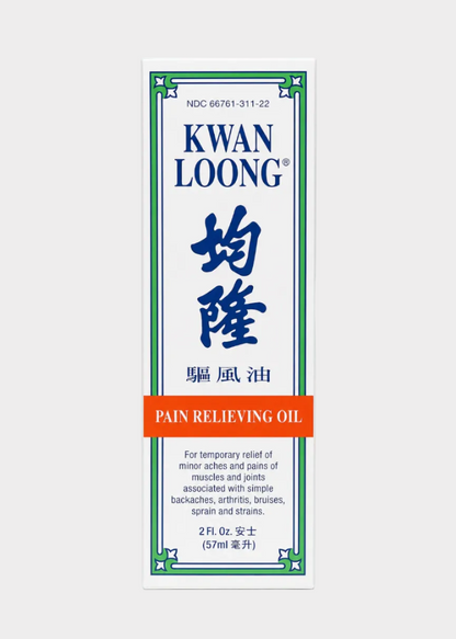 Kwan Loong Pain Relieving Oil packaging on a white background