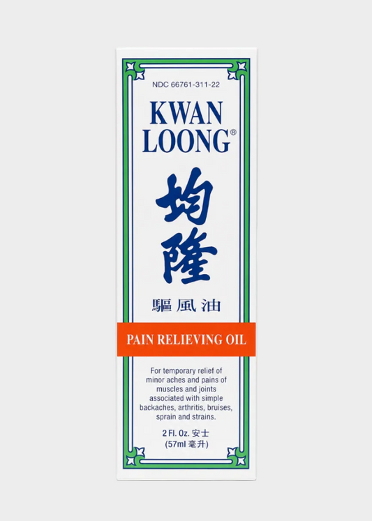 Kwan Loong Pain Relieving Oil packaging on a white background