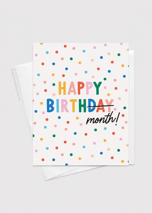 Greeting card with colorful polka dots and 'Happy Birthday month!' text on a white background