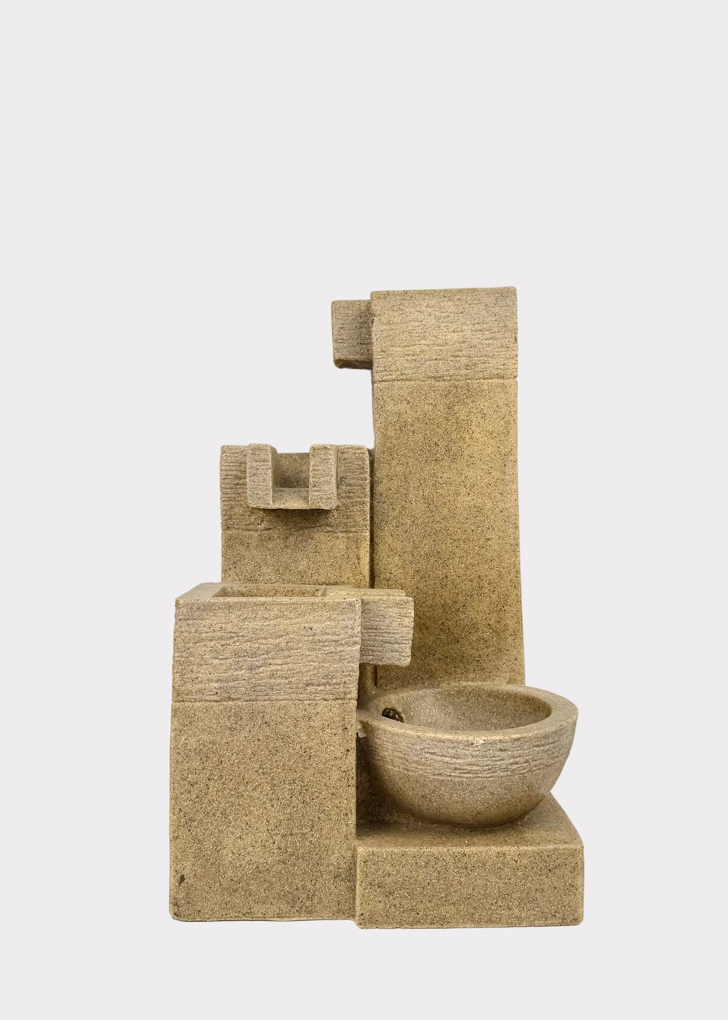 Stone fountain with water feature on a white background