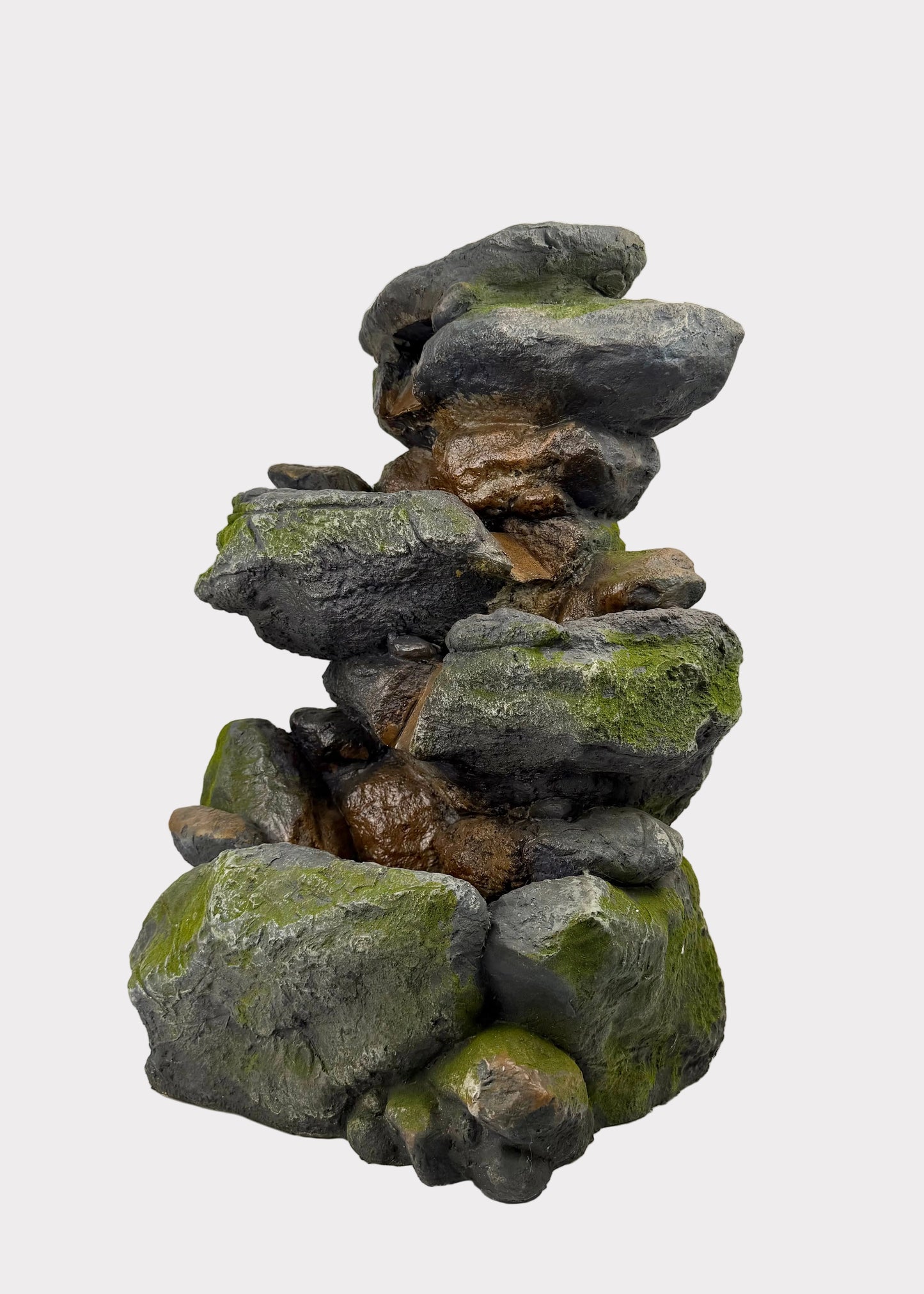 Stack of decorative rocks with green moss on a white surface