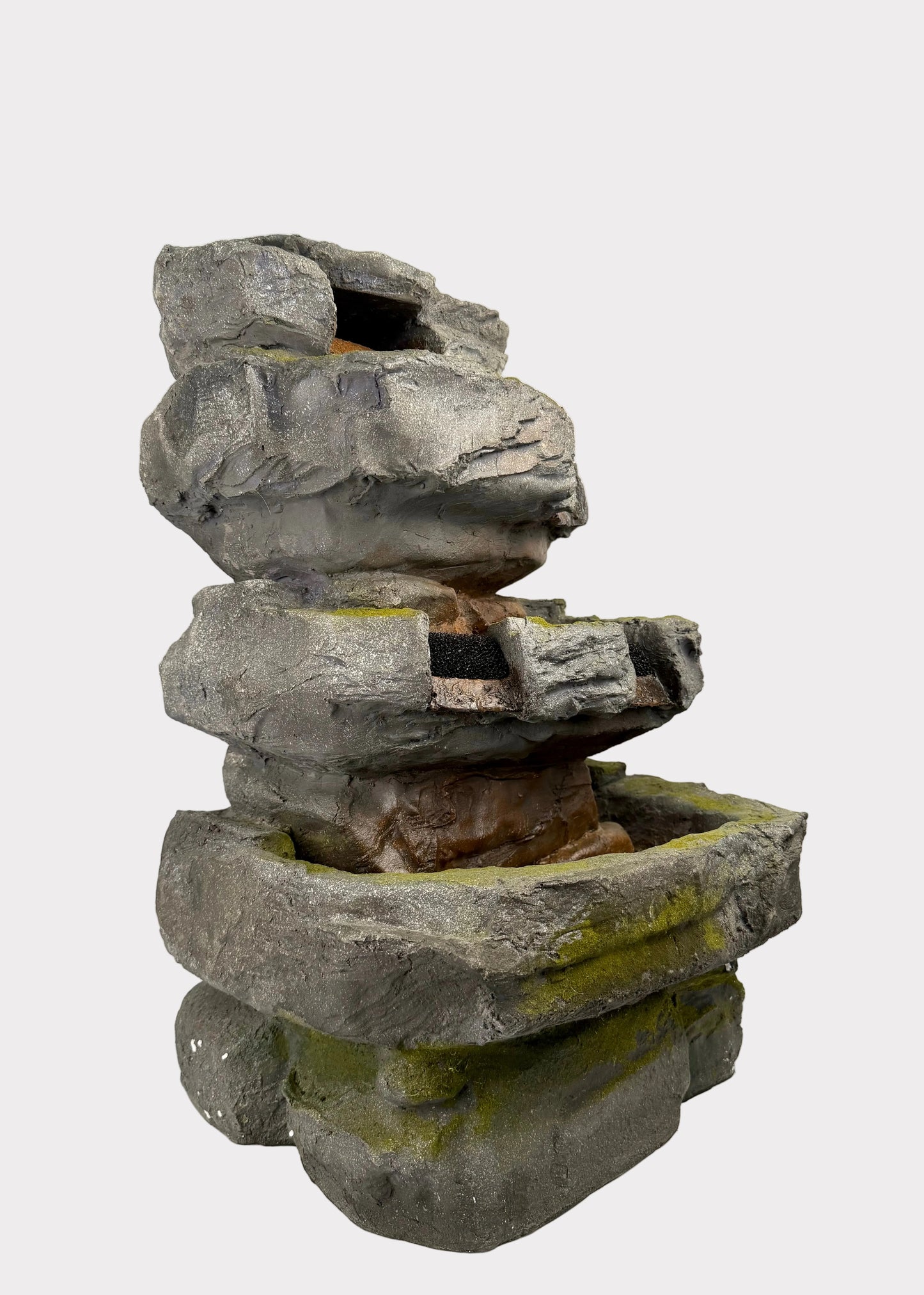 Stack of stone blocks fountain with a white background