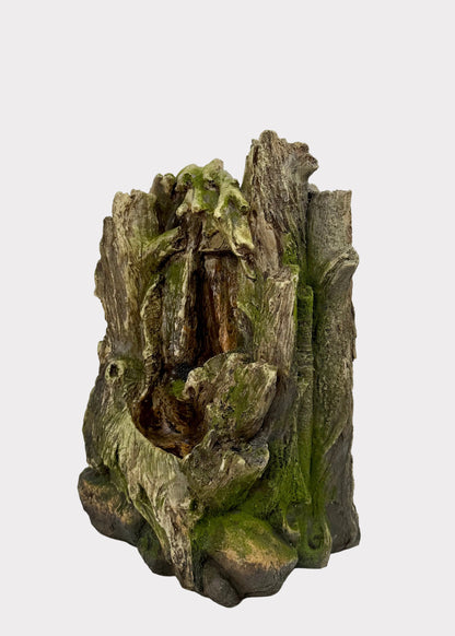 Decorative piece resembling a natural wood log with moss on a white background