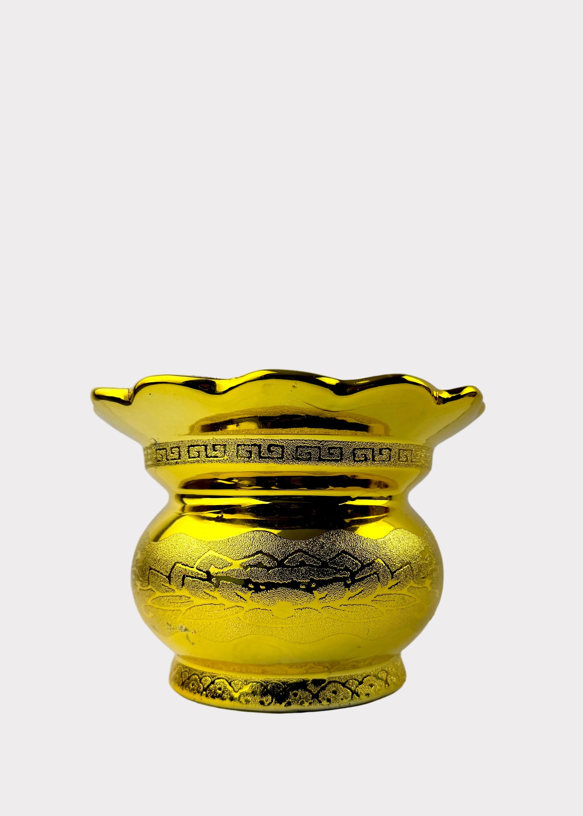 A shiny gold-colored ceramic vase with a scalloped rim, featuring hand-painted mountain and cloud patterns on the body and a Greek key border around the neck, set against a plain light gray background.