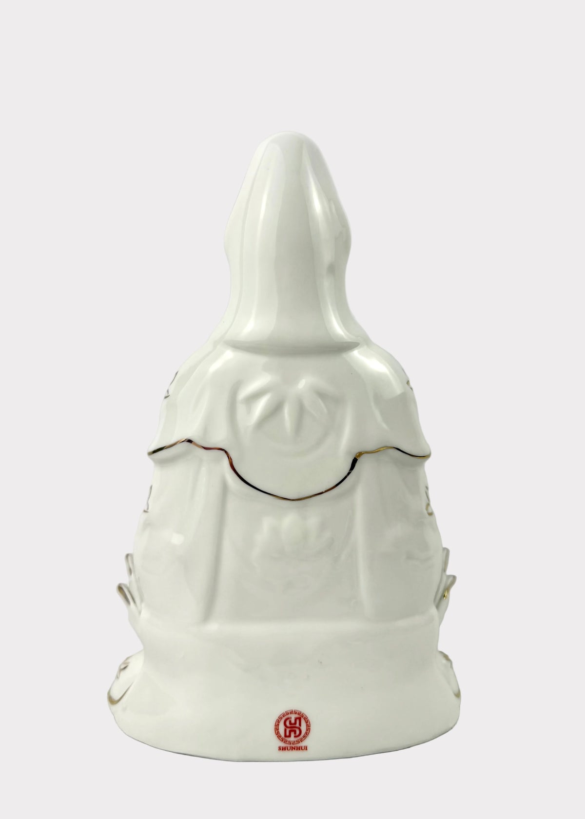 A white ceramic figurine of Kwan Yin back
