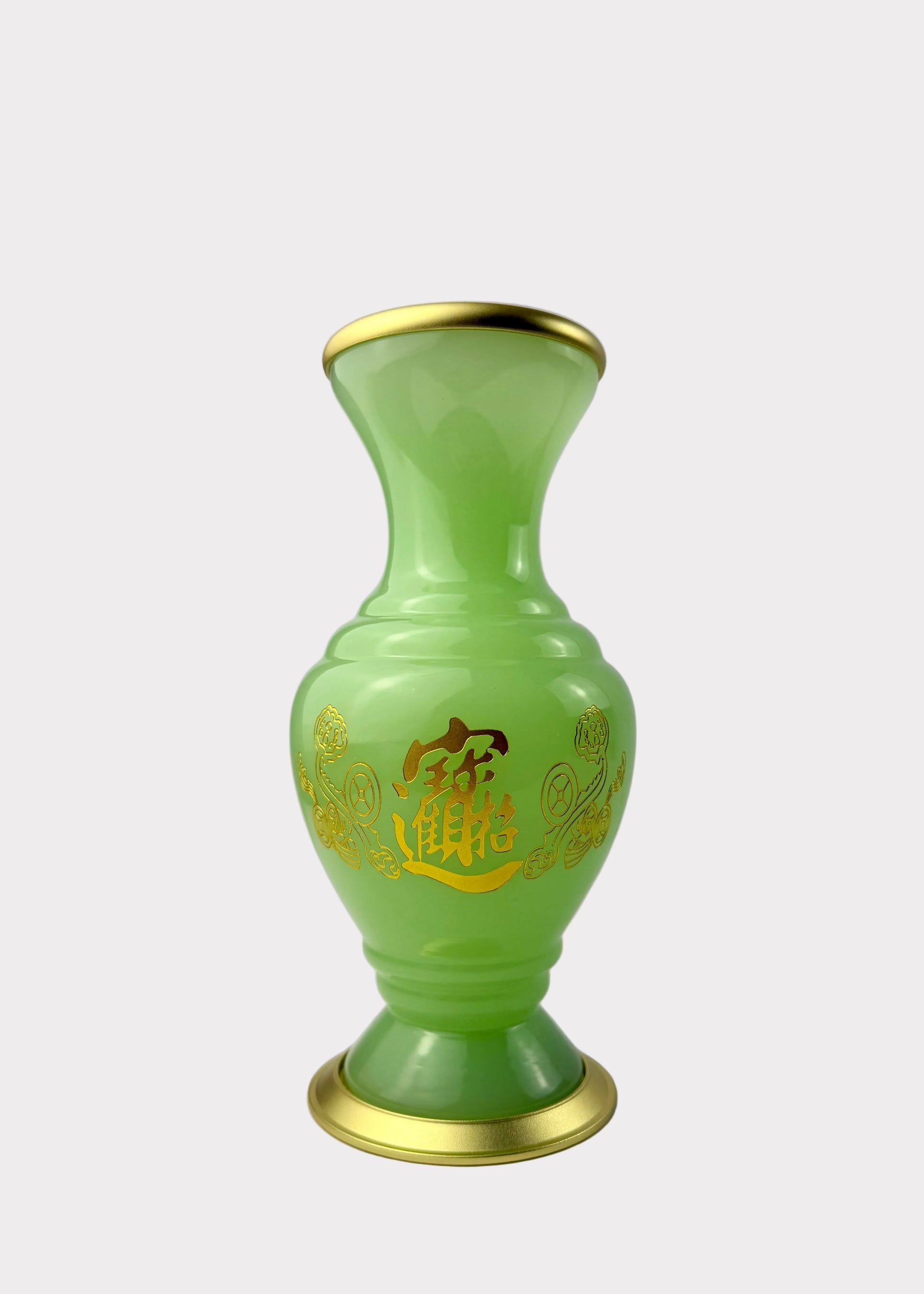 A small translucent light green vase with gold trim at the rim and base, featuring gold Chinese characters and floral patterns on the front, set against a plain light gray background.