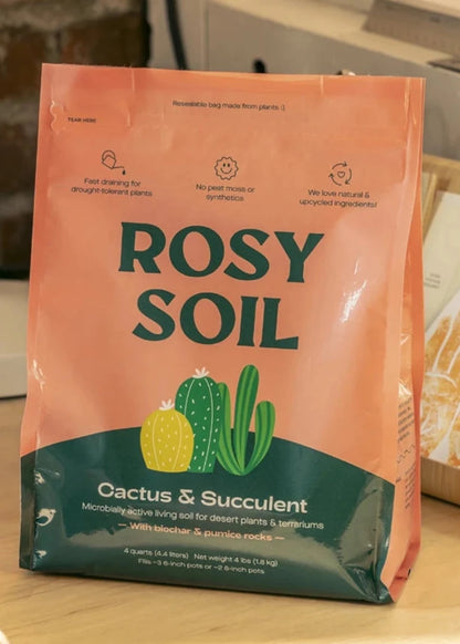 Bag of Rosy Soil for cactus and succulent plants on a wooden surface.