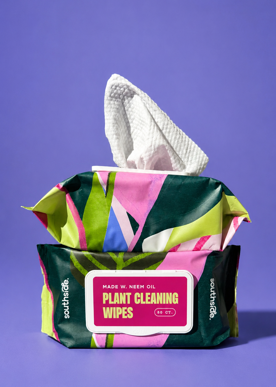 Colorful packaging of plant cleaning wipes on a purple background