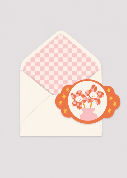 Envelopes with a decorative label featuring flowers on a light gray background