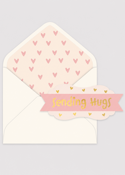 Card with 'Sending Hugs' text and heart-patterned envelope on a light gray background