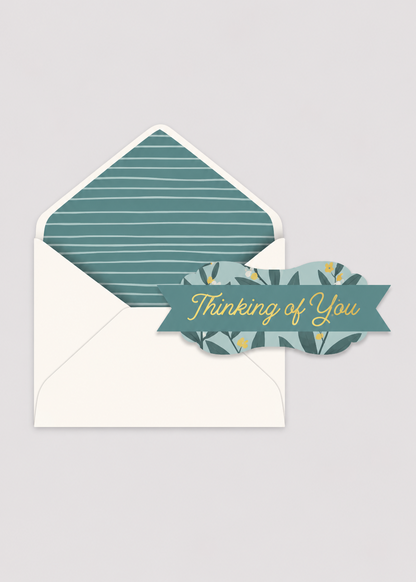 Envelopes with a decorative card labeled 'Thinking of You' on a light gray background