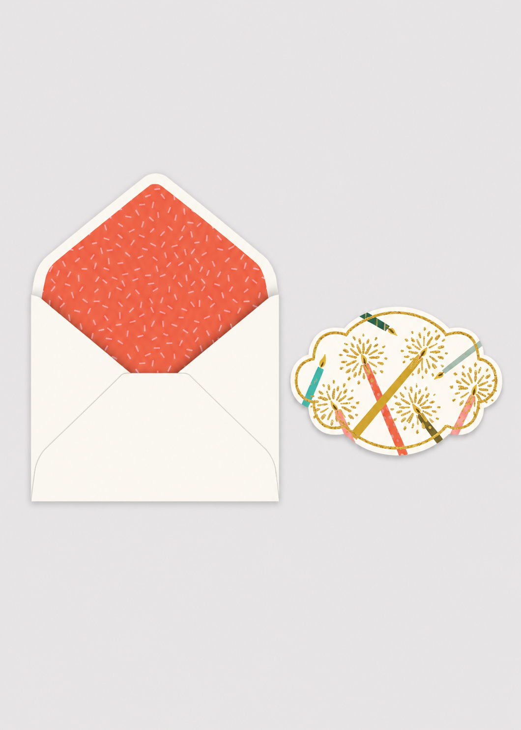 Greeting card with orange patterned envelope and decorative sticker on a gray background