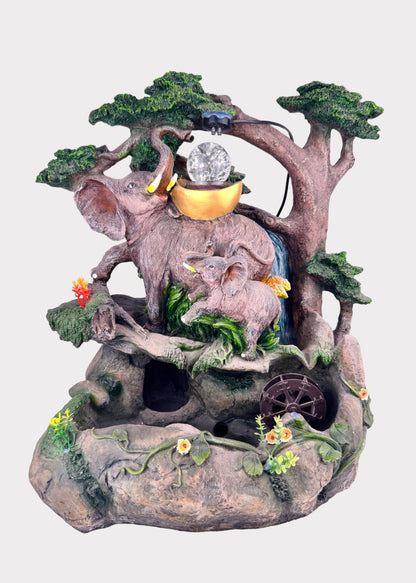 Forest elephant family fountain with LED crystal ball, tree design, and water wheel – front view - Rainbow Rosemead