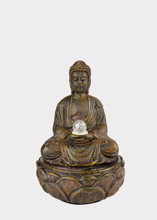 Meditation Buddha fountain in wood-grain resin holding glowing crystal ball –  front view - Rainbow Rosemead