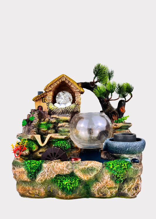 Mountain cottage tabletop fountain with LED crystal ball, glass bowl, and water wheel - front view - Rainbow Rosemead