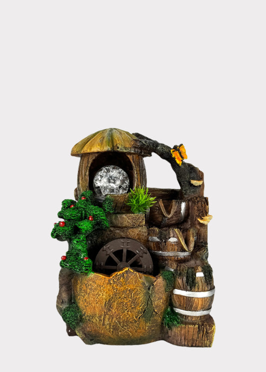 Rustic barrel water wheel fountain with LED crystal ball and greenery accents - front view - Rainbow Rosemead