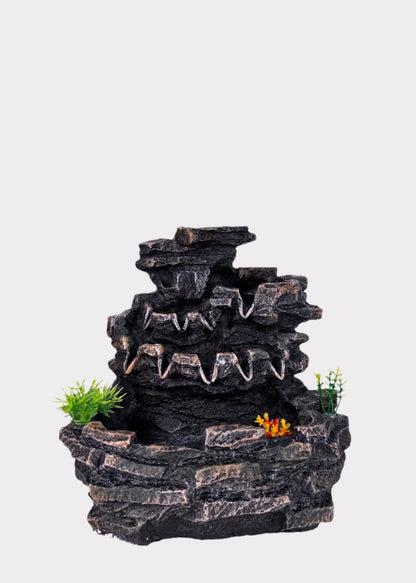 Tiered rock cascade tabletop fountain with rugged stone texture and flowing water - front view - Rainbow Rosemead