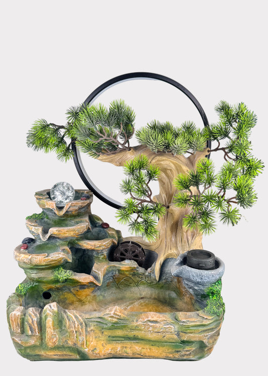 Zen pine ring tabletop fountain with bonsai tree, LED crystal ball, and water wheel - front view - Rainbow Rosemead